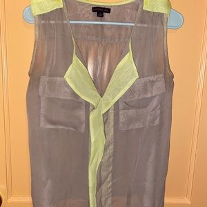 Tan sleeveless blouse with pockets